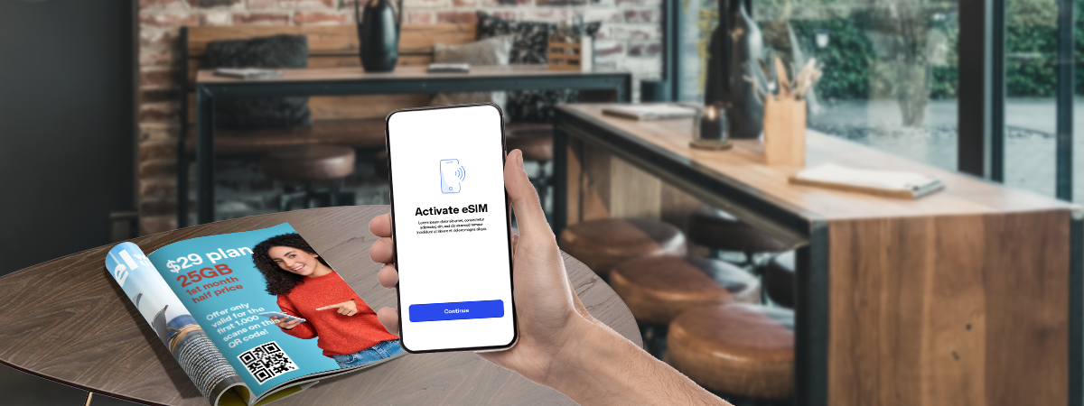 Scanning a QR code in a magazine to activate eSIM